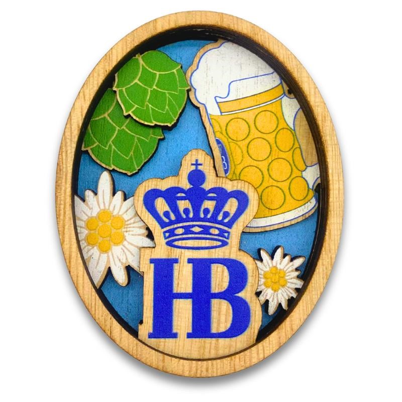 ovaler Holzmagnet mit HB-Jogo-Krone, Maßkrug, Hopfen und Edelweiß-Motiv