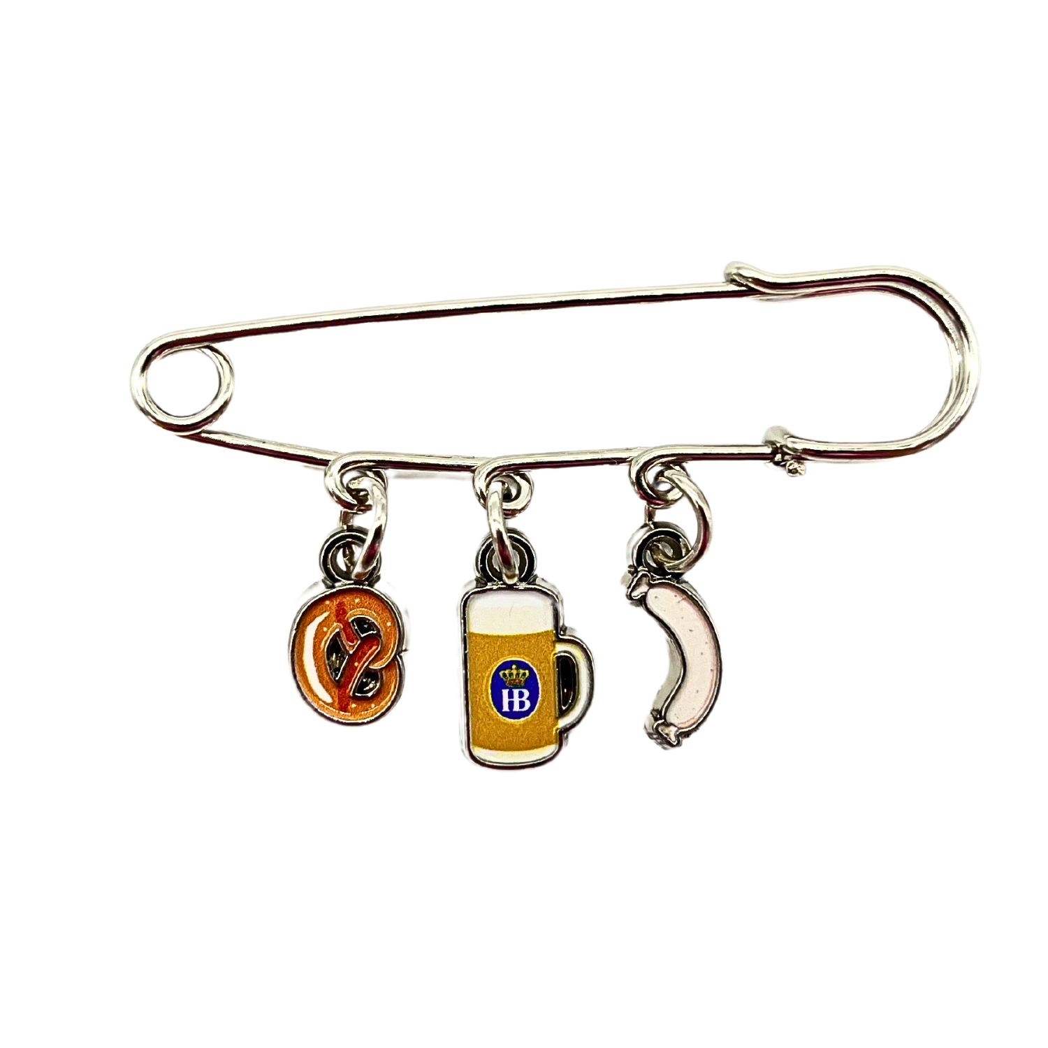 Brosche mit drei Anhängern: Brezel, Bierkrug mit HB-Logo und Weißwurst.